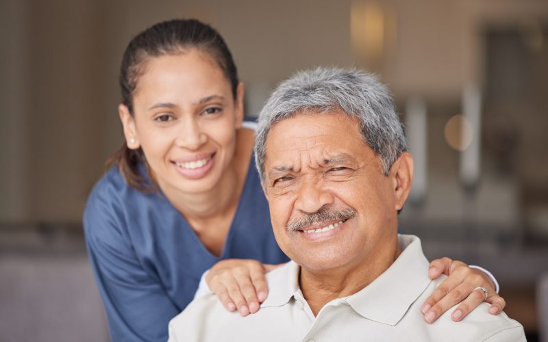 portrait-of-elderly-man-with-a-nurse-bonding-during-a-checkup-at-assisted-living-homecare-smile-.jpg